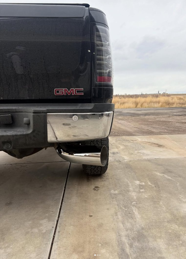 Rear-left view of a GMC truck exhaust upgrade