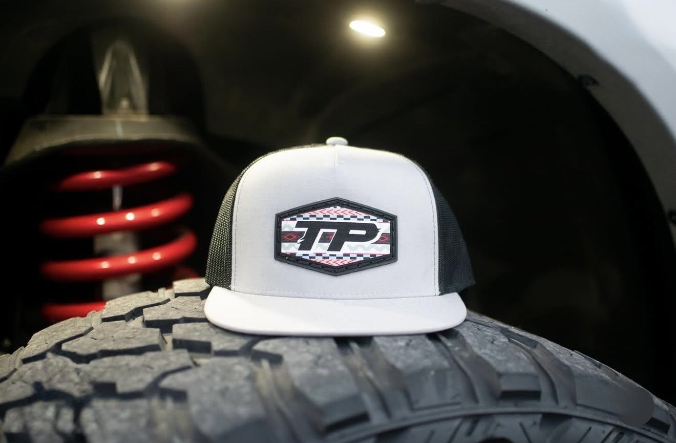 Tibbets Performance hat displayed on a tire
