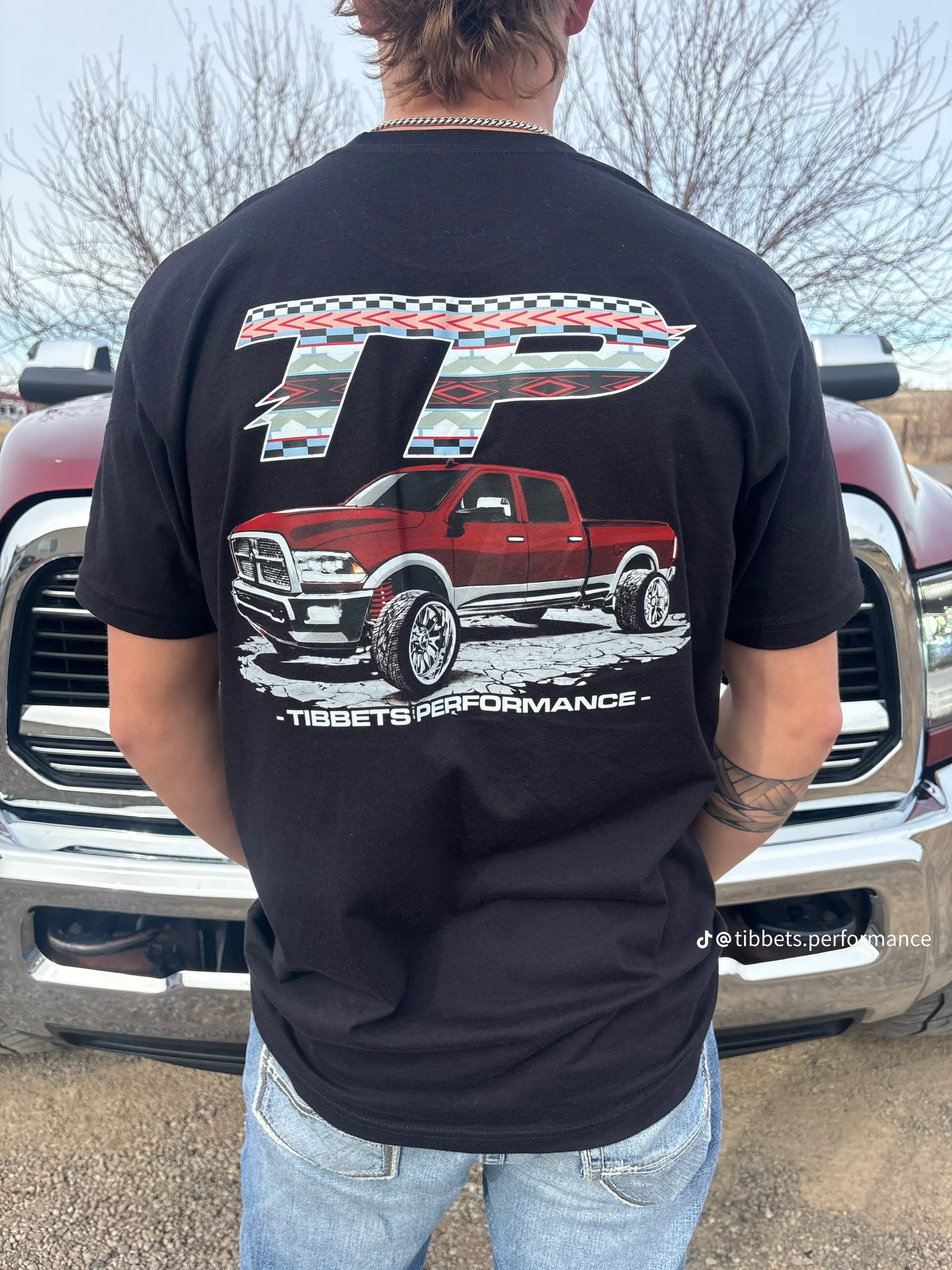 Close-up of the back graphic on the Tibbets Performance shirt