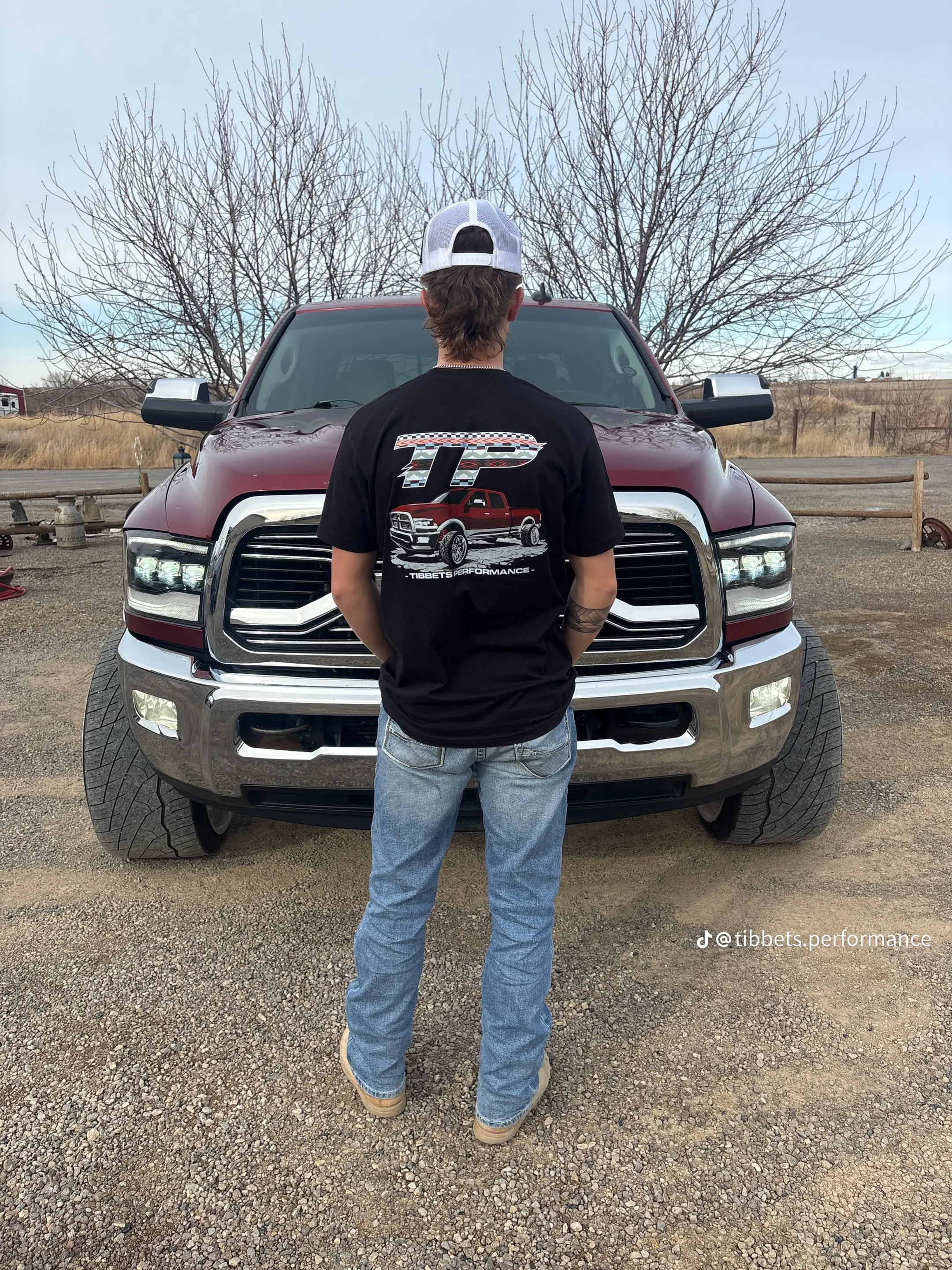 Full view of the black TP shirt standing in front of the truck