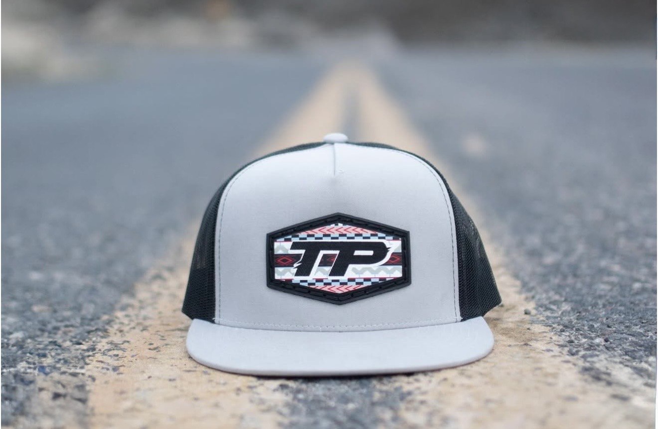 Tibbets Performance hat sitting on a road